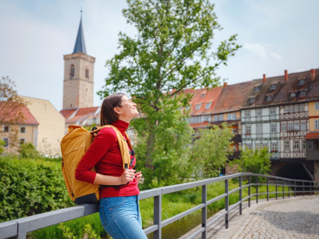 Tourist woman explores beautiful city of Erfurt,